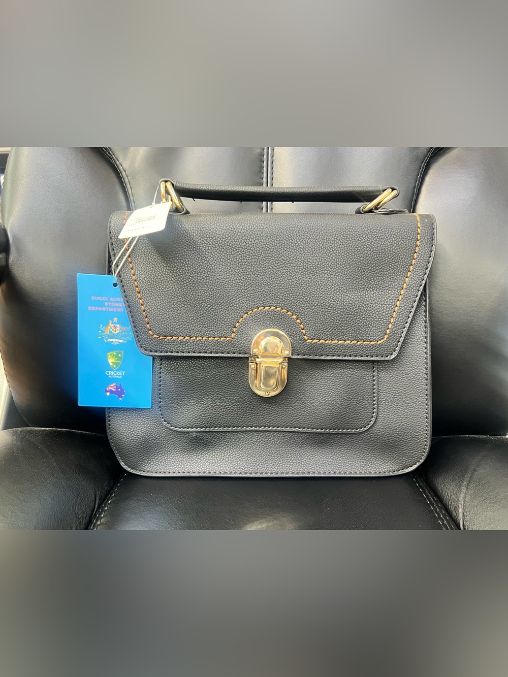 Classic Black Leather Top-Handle Bag with Gold Hardware